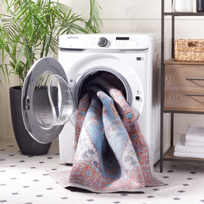 Tapis oriental bleu / rose