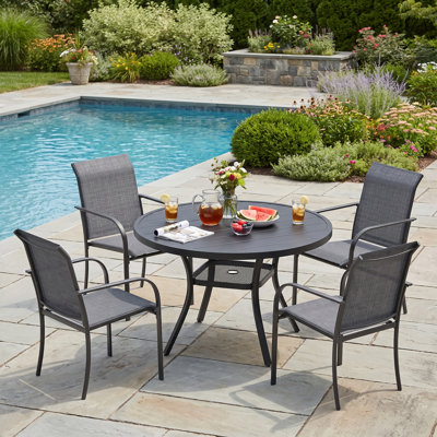Ensemble de salle à manger de patio pour 4 personnes avec chaises empilables PVC-coated polyester