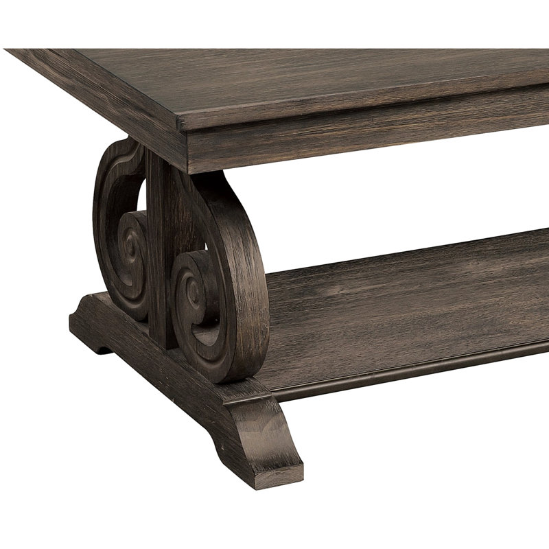 Table traditionnelle avec finition en chêne foncé et base à volutes avec tablette classique