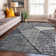 Tapis contemporain délavé à motif géométrique