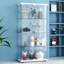 Élégante vitrine autoportante verrouillable sur pied en verre trempé à 4 tablettes Silhouette Clean