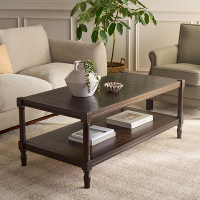 Table basse à 4 pieds en bois massif avec rangement Gladston