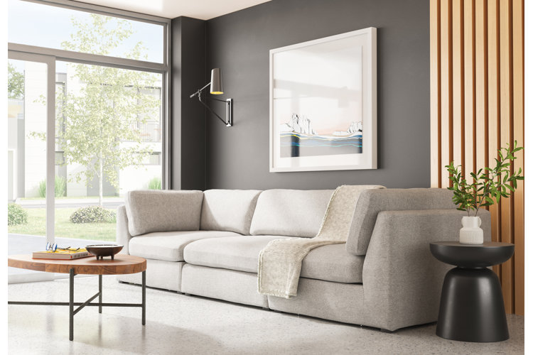 Living room with gray sofa and black focal wall.