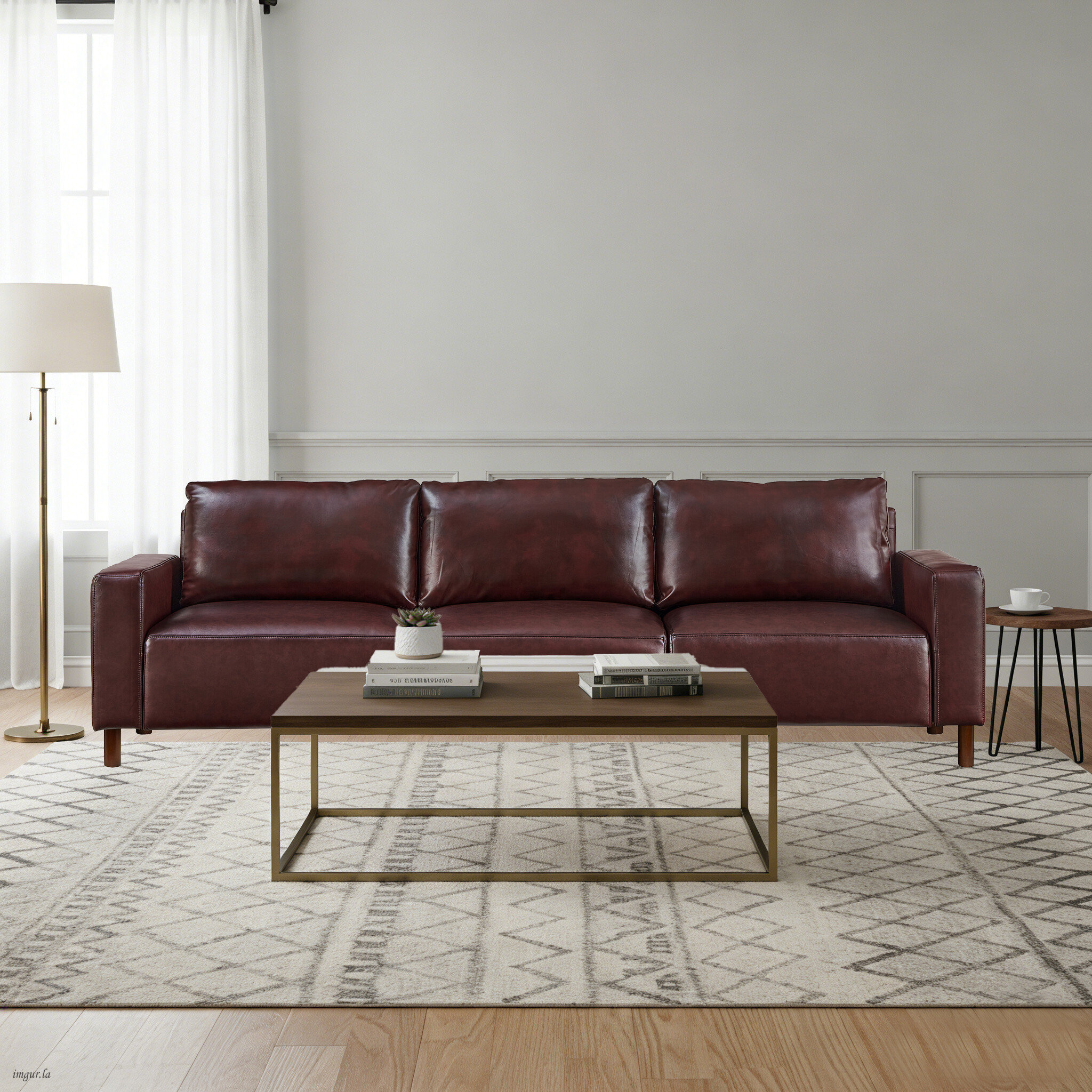 Latitude Run® Modern three-seater faux leather sofa with plush cushions ...