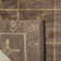 Tibetan Plum Pictogram Brown Area Rug