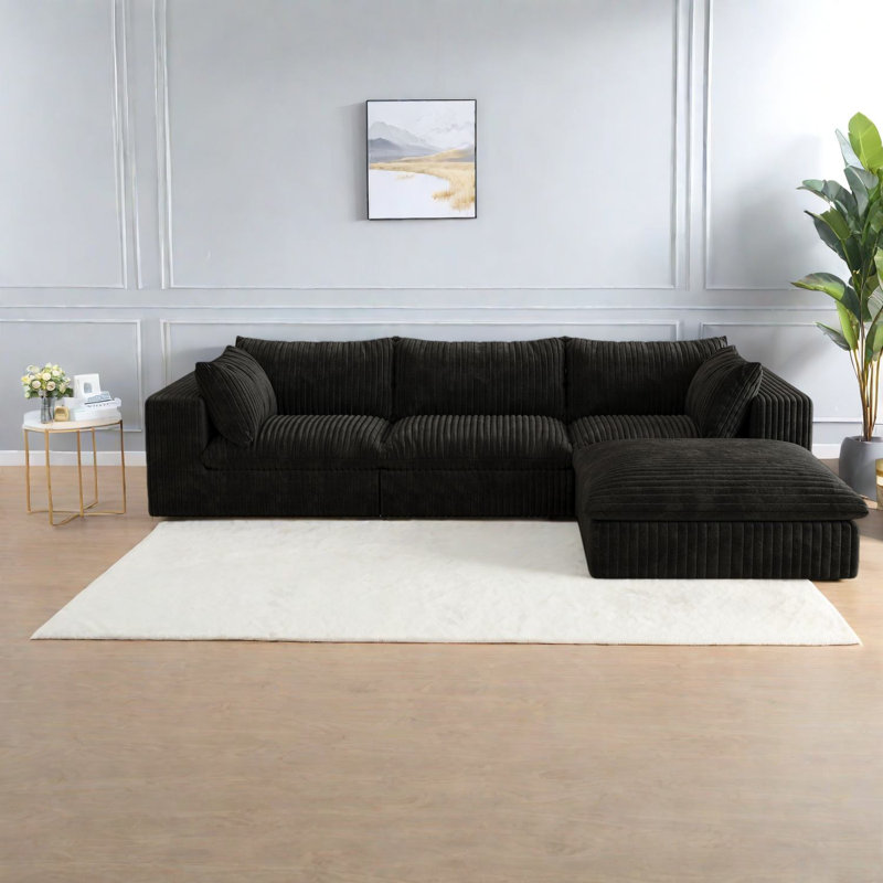 Canapé luxueux en velours côtelé, assise profonde, noir, idéal pour les espaces de vie