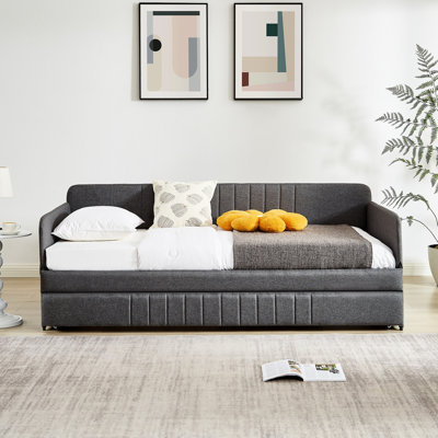 Lit de jour gris avec lit gigogne pour lit simple, structure en métal stable Un lit simple paisible dans un salon gris et silencieux