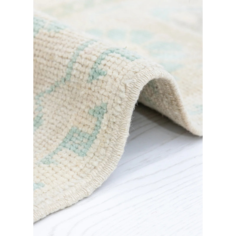 Tapis crème oriental en laine rétro