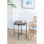 Table d'appoint ronde avec structure unique en métal