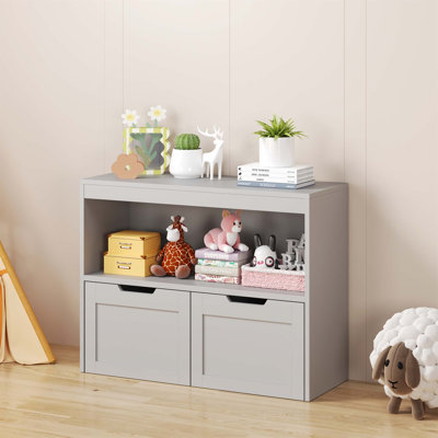 Armoire de rangement pour livres et jouets spacieuse avec tiroirs et tablettes, parfaite pour organiser et maximiser l'espace de la pièce.