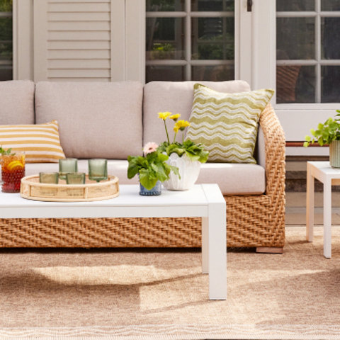 Outdoor patio furniture set with a coffee table.