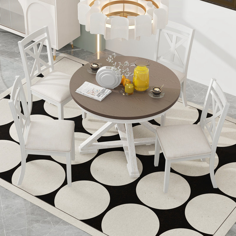 Table ronde extensible et 4 chaises rembourrées