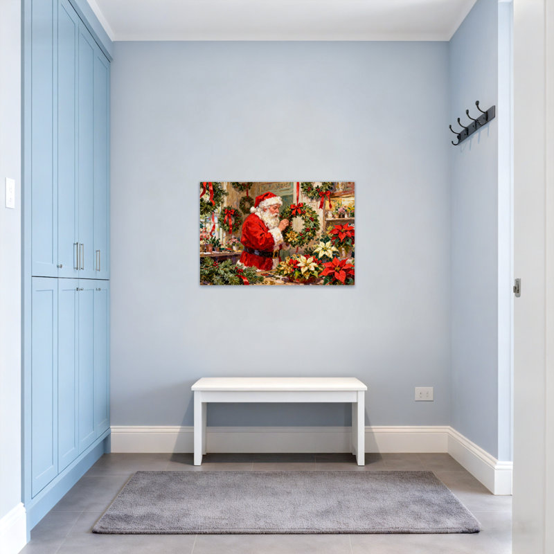 Couronne de Noël père Noël avec poinsettias et verdure, H 12 po x l 18 po