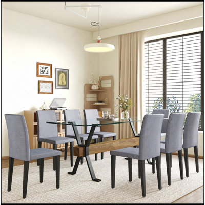Ensemble de table et de chaises. Plateau de table en verre trempé de 79 po x 31,5 po avec pieds en métal noir en forme de X, traverse en panneau de fibres à densité moyenne à grain de bois texturé.
