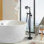 Robinet de baignoire autoportant monocommande à fixation au sol avec douche à main