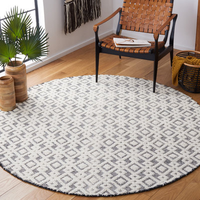 Tapis ivoire / noir tissé à la main Franson
