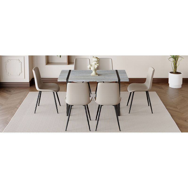 Structure de table et chaise en marbre gris texturé moderne avec base en métal robuste, ensemble de coussins confortables