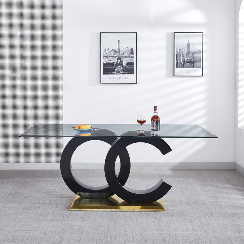 Table de salle à manger en verre trempé avec support central en panneau de fibres à densité moyenne noir et base en acier inoxydable pour un design moderne