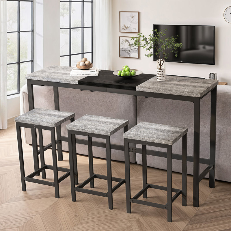 Ensemble de table de salle à manger moderne et fonctionnel avec trois tabourets, idéal pour les petits espaces et la vie sans effort