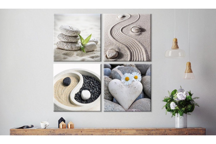 wall art depicting yin and yang over a shelf with candles and a floral arrangement