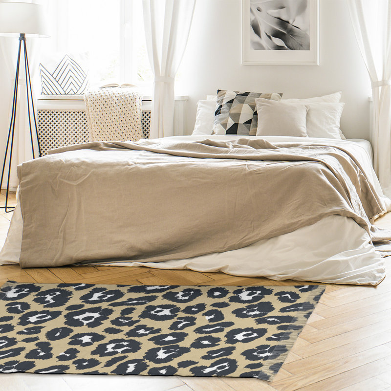 Tapis beige / noir à imprimé animal
