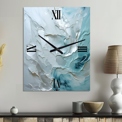 Horloge murale argentée