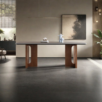 Une table de salle à manger en granit avec des pieds en bois de frêne