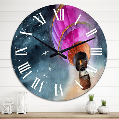 Horloge murale en forme de montgolfière rose dans la nuit étoilée