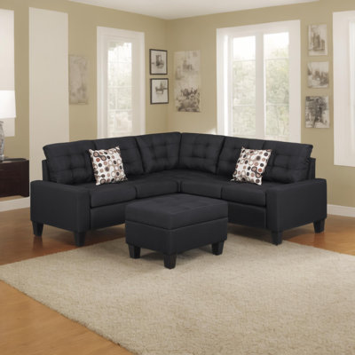 de canapé modulaire rembourré noir avec une conception modulaire, parfait pour les salons spacieux