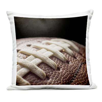 Football Closeup On Black Outdoor Printed Pillow, design by Kim Allen