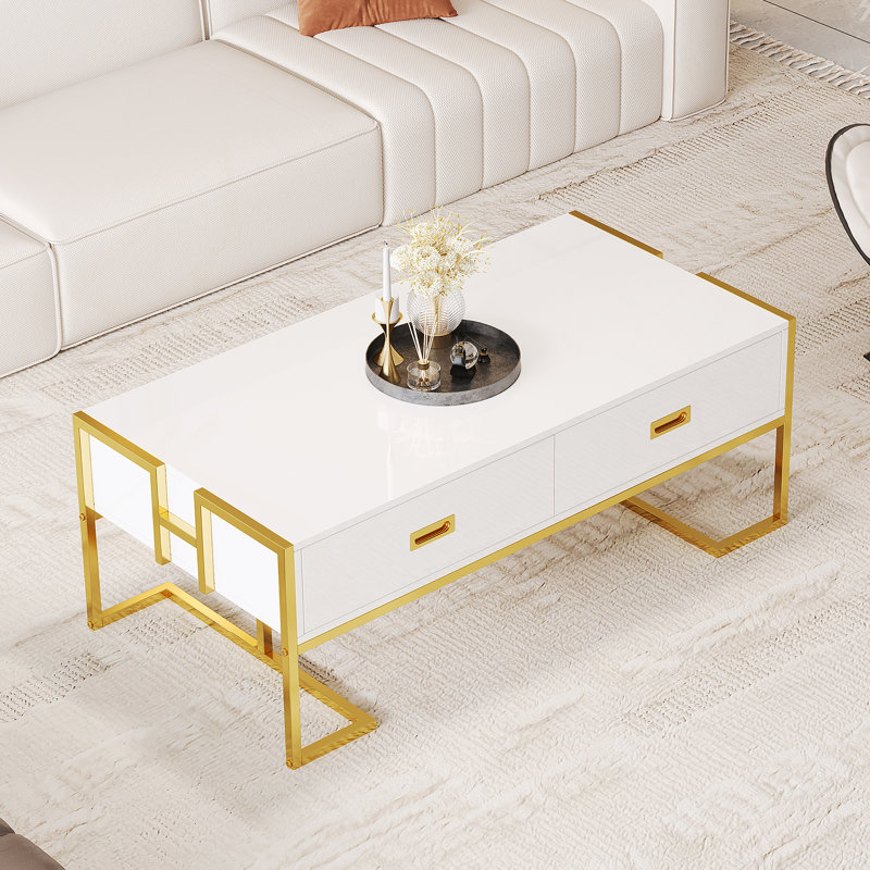 Élégante table basse rectangulaire moderne avec quatre tiroirs et une base distinctive, idéale pour les espaces de vie contemporains et une fonctionnalité améliorée