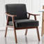 Chaise d'appoint Mid-Century moderne en similicuir noir - compacte et élégante pour tout espace de vie