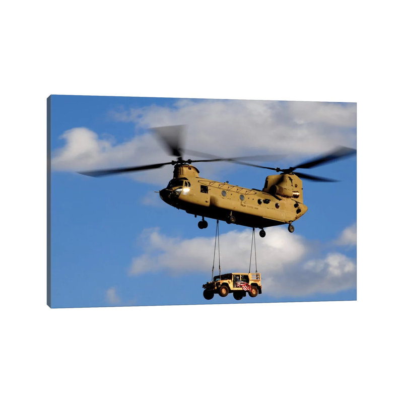 A US Army CH-47 Chinook Helicopter Transports A Humvee by Stocktrek Images - Wrapped Canvas Print