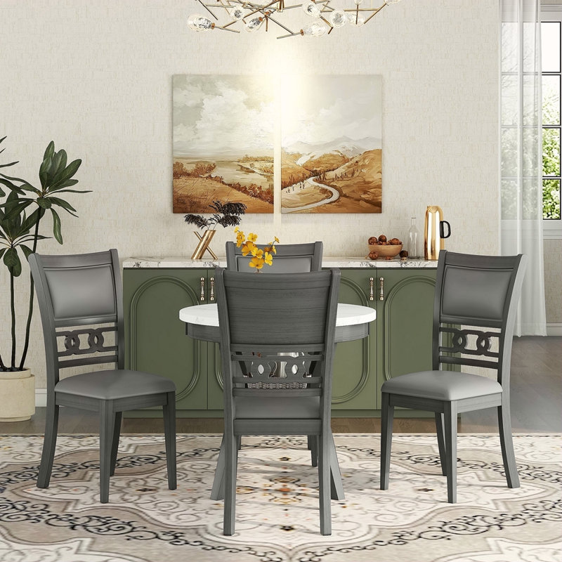 Ensemble de table ronde 5 pièces avec une table de salle à manger en faux marbre et quatre chaises en similicuir