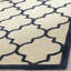 Tapis en laine touffeté à la main Cannen-982734930