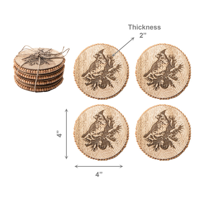 Ensemble de 4 sous-verres ronds à perles gravés d'un cardinal