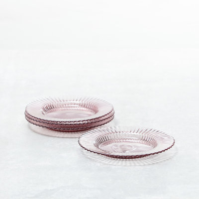 Faceted pink stoneware plate with a moulded angular surface
