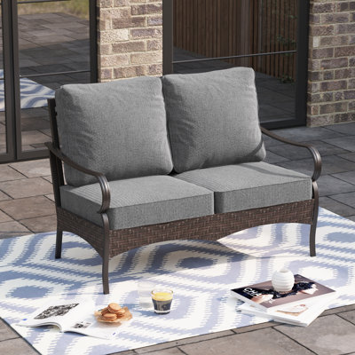 53'' Wide Metal Outdoor Loveseat with Cushions & Wicker Decor