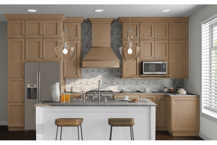 neutral modern kitchen with beige upper and lower cabinets and beautiful gray hexagonal backsplash 