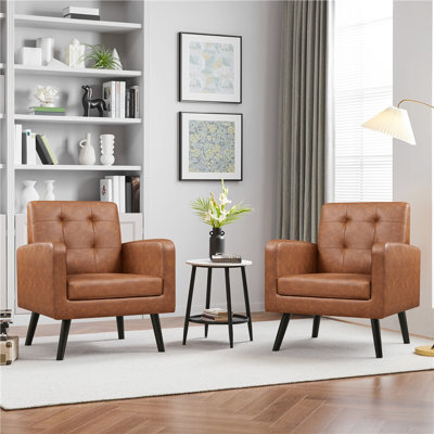 Fauteuil moderne en similicuir capitonné