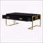 Table basse moderne noire moderne avec 4 tiroirs spacieux et une base dorée élégante, parfaite pour les espaces de vie contemporains.-102435894