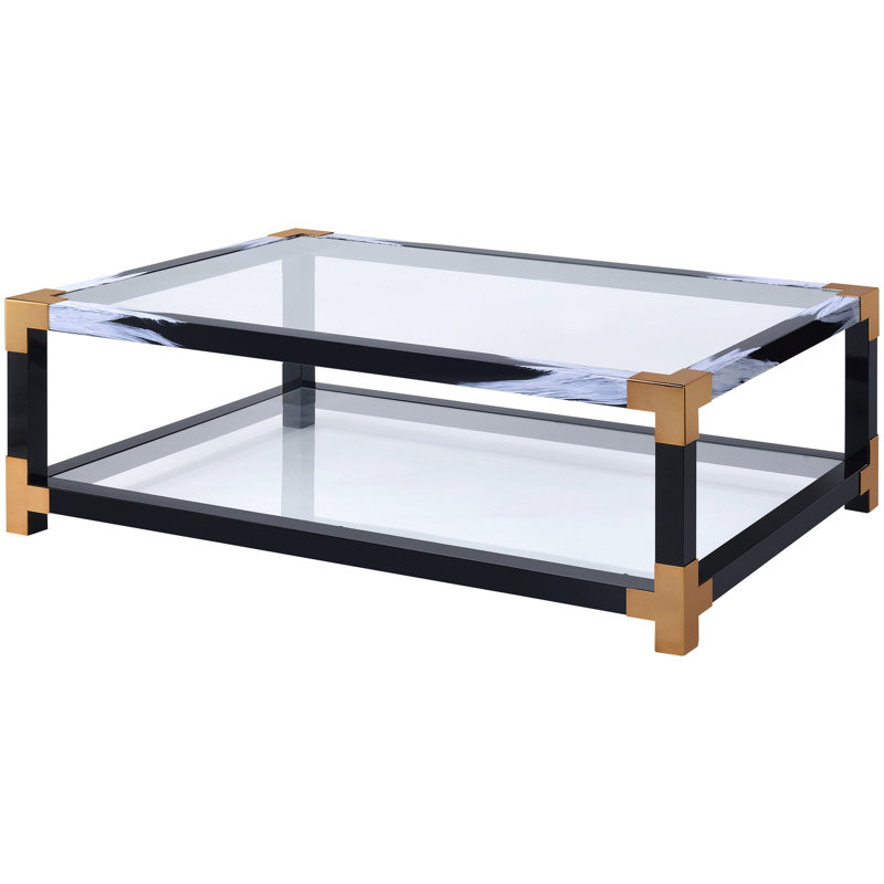 Table basse moderne avec pieds en métal et surface en verre transparent