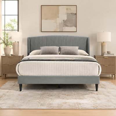 Grand lit tapissier contemporain avec tête de lit courbée Jolande