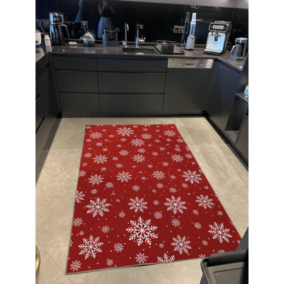 Tapis décoratif rouge à motif de flocons de neige rouge