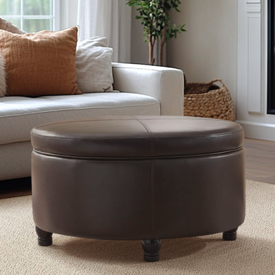 Repose-pieds rond avec rangement en similicuir Duanys