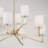 32" W x 9.25" H 9-Light Two-Tier Chandelier in Matte Brass with Clear Acrylic Accents and Cylindrical White Fabric Shades