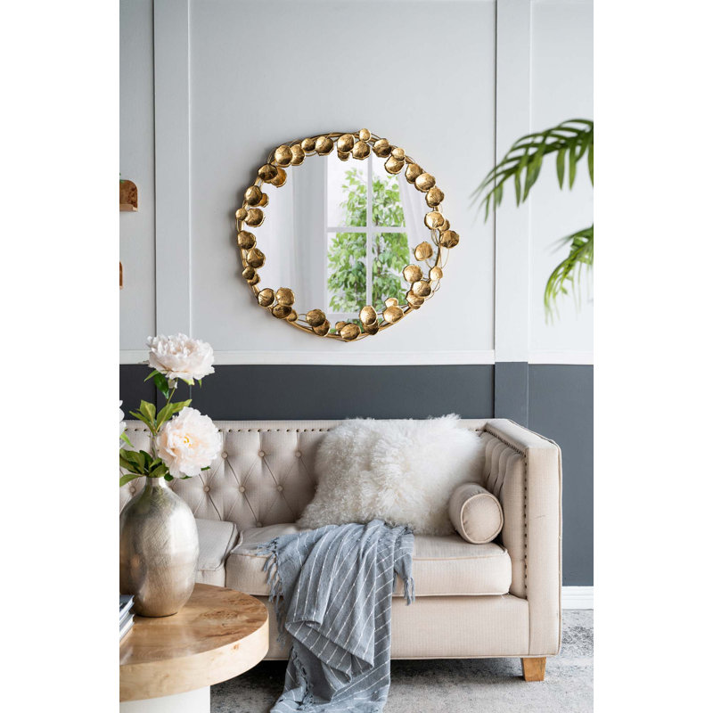 Miroir mural rond en métal avec détails dorés