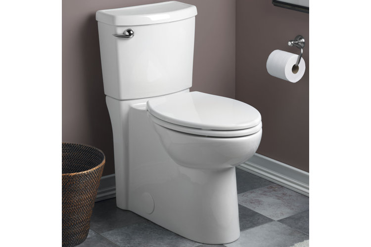 Bathroom with a white toilet and a round-shaped toilet bowl.
