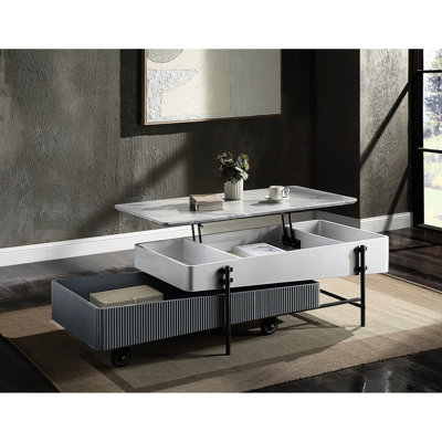 Table basse grise et blanche laquée brillante avec plateau relevable et espace de rangement pratique