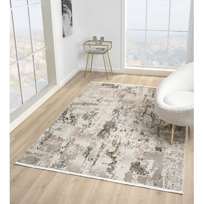 Tapis abstrait beige / bleu de la collection Taige